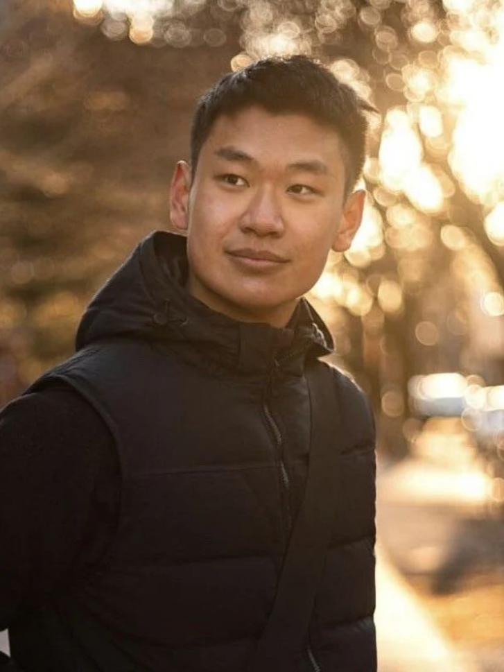 Edward Tian, GPTZero founder, in a winter park at golden hour